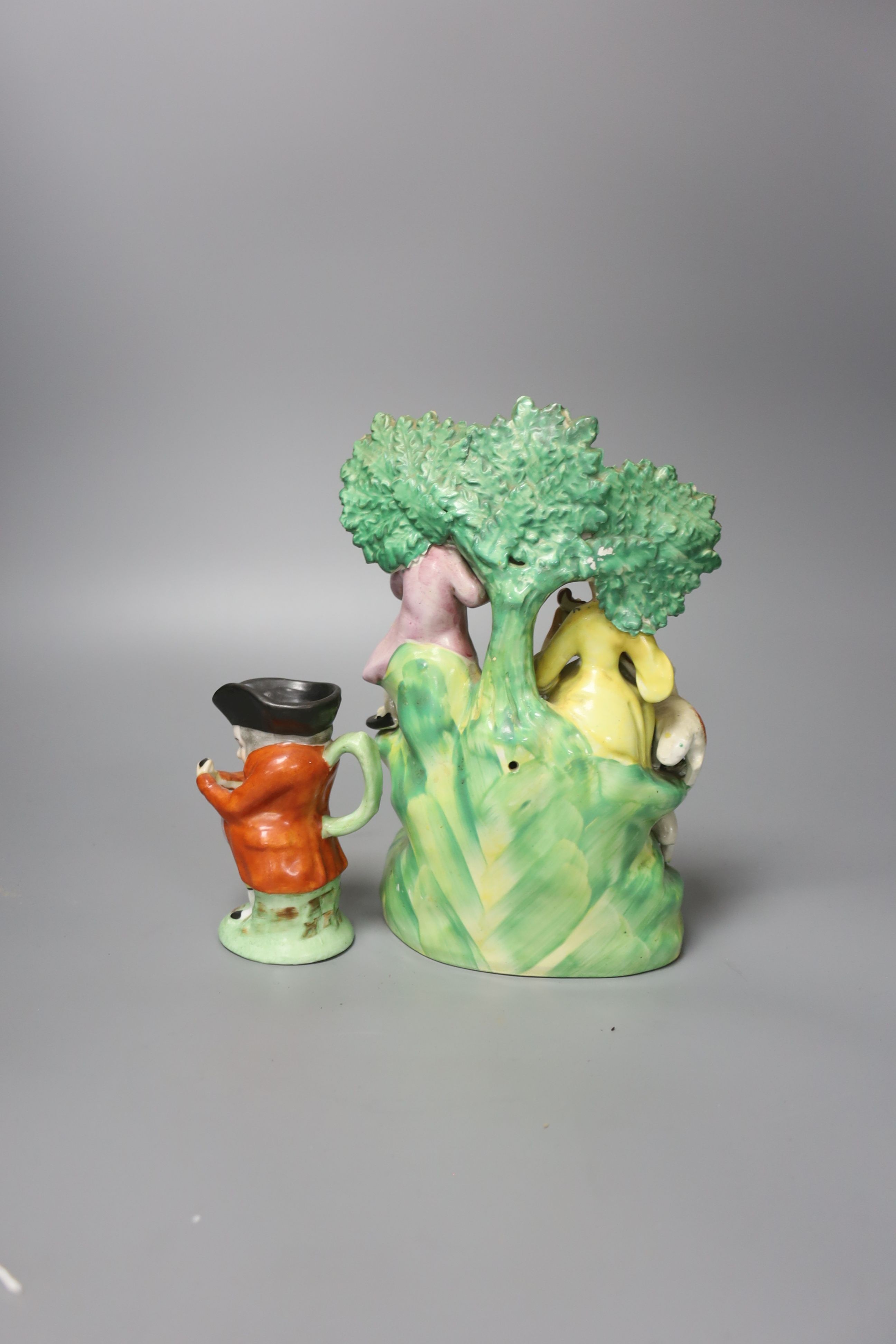 A Staffordshire figure group and character jug 21cm